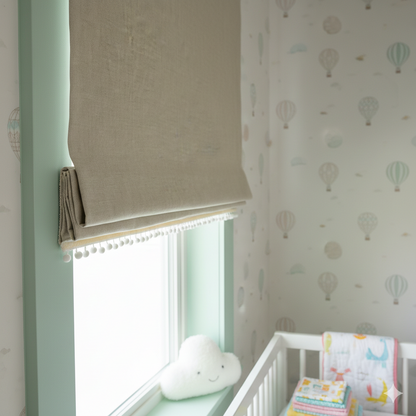 Nursery room with a blackout linen flat roman shade, a window, crib, and decorative wallpaper.