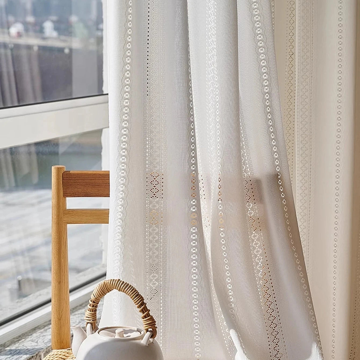 White lace sheer curtain beside a window with a ceramic teapot, lace stripe detail, CD1049