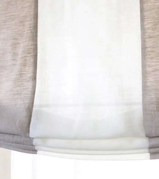 Close-up of a window shade with a neutral color scheme on a white background