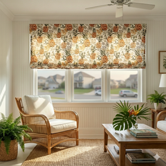 Living room with pineapple linen flat roman shade, wicker chair, and wooden coffee table.
