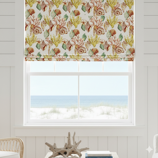 Window with sea life patterned roman blind and view of ocean.