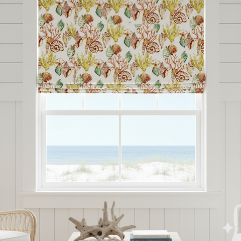 Window with sea life patterned roman blind and view of ocean.