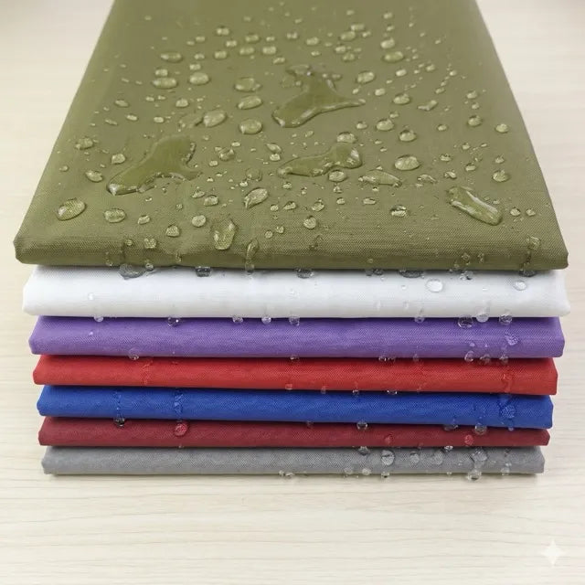 Stack of colorful sheets with water droplets on a light background