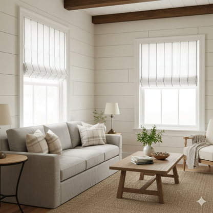 Cozy living room with a gray sofa, wooden coffee table, white walls and striped linen flat roman shade.