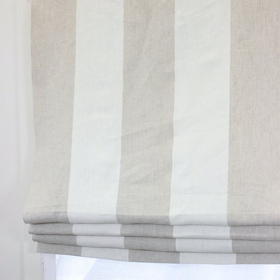 A 5-inch wide stripe Roman shade in a serene combination of beige and white colors. Crafted from 100% natural linen fabric, this window treatment exudes a timeless and elegant appeal, adding a touch of sophistication to any space.