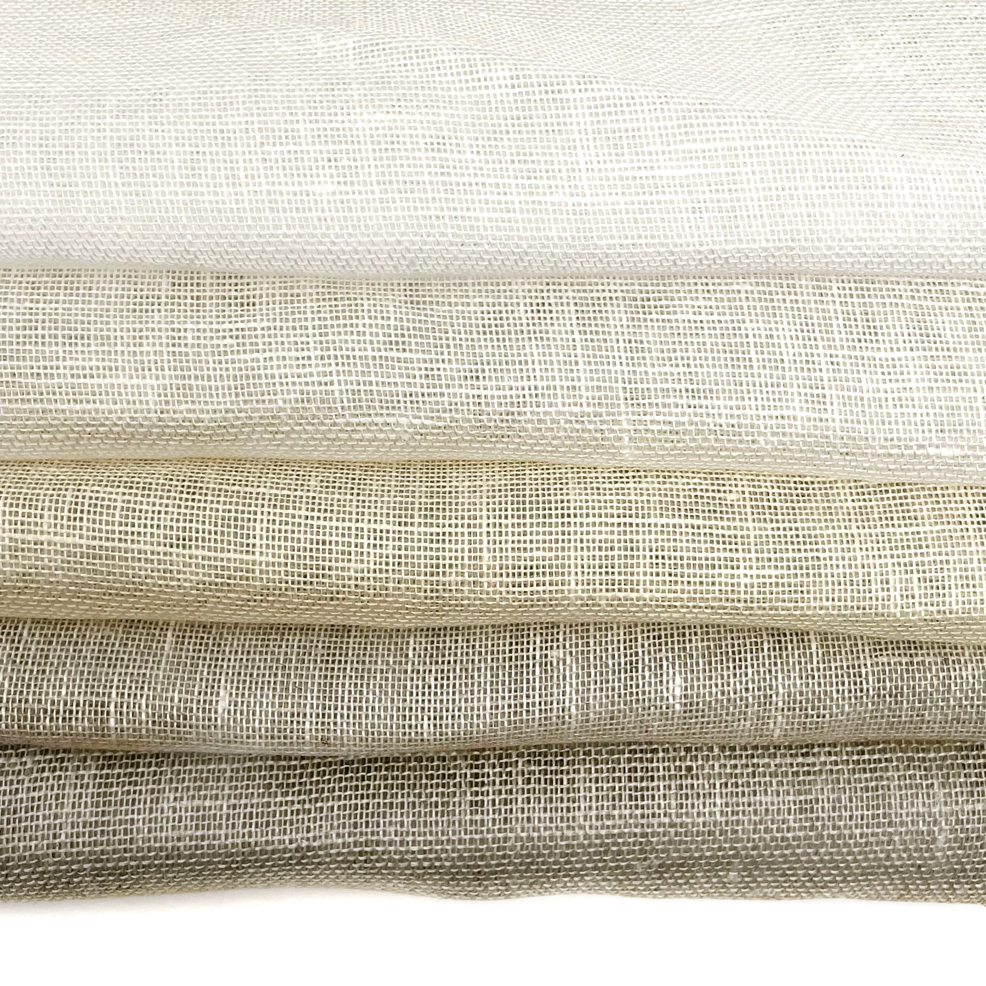 Rustic sheer linen fabric in natural tones, ideal for curtains and home decor.