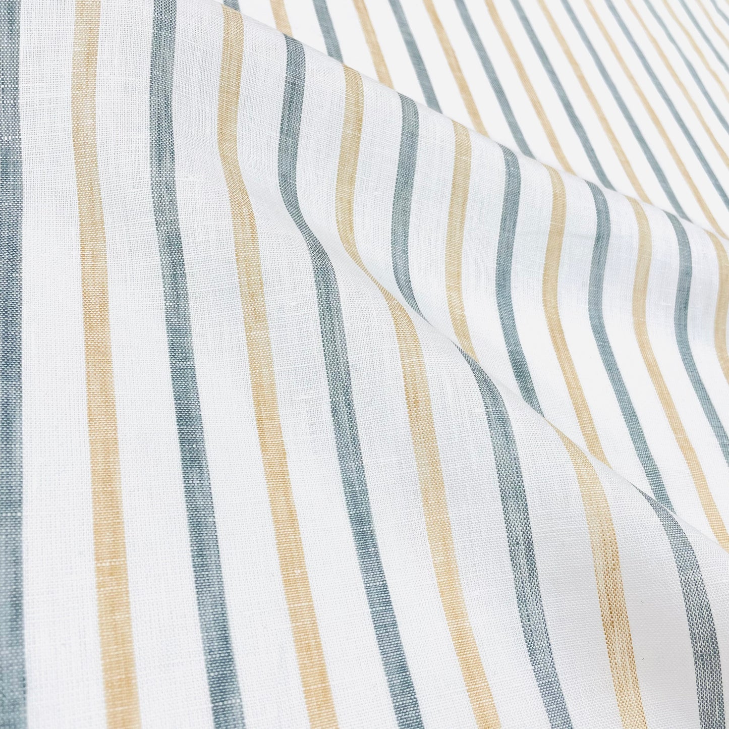 White linen fabric with alternating green and yellow vertical stripes.