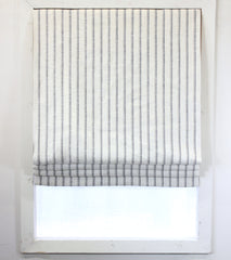 beige and grey striped off-white linen flat roman shade.
