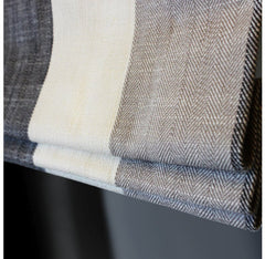 White, light grey and dark grey striped linen flat roman shade.